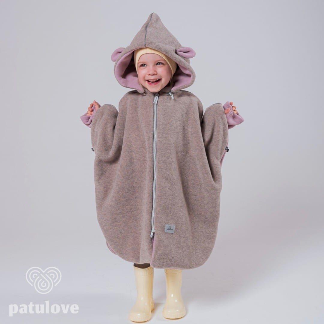 3. Smiling child in Patulove pink lamb car poncho with hood and yellow boots, front view in studio