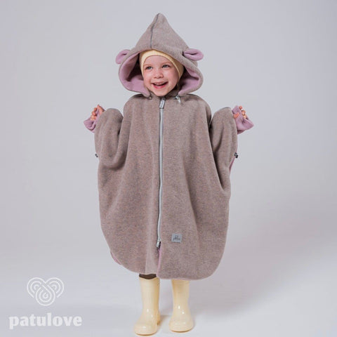 3. Smiling child in Patulove pink lamb car poncho with hood and yellow boots, front view in studio