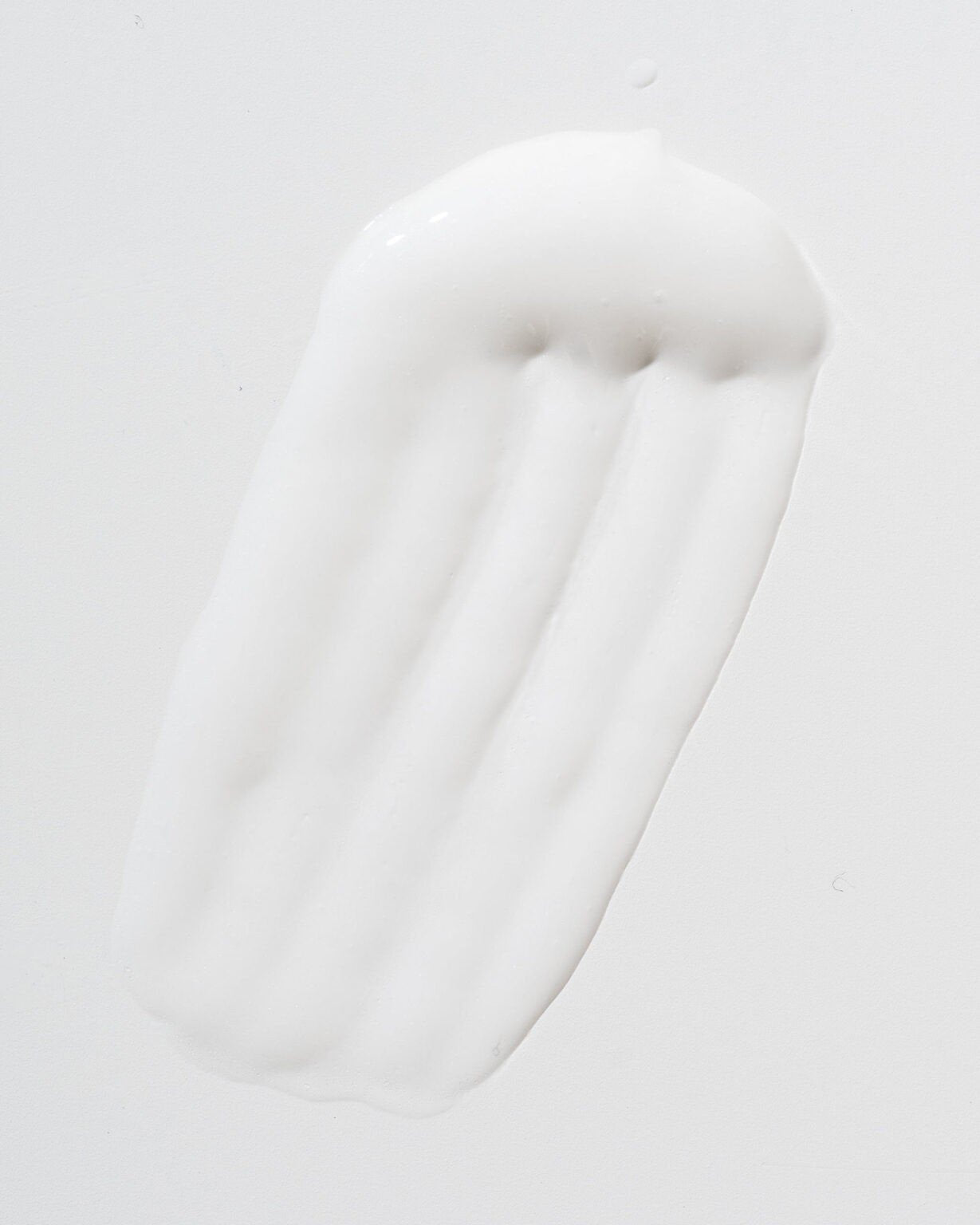 3. Close-up of LUUV Cellulite Treatment COSMOS cream texture on white background