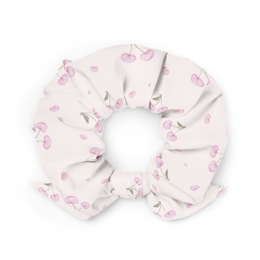 1. Light pink scrunchie with cherry blossom print made from recycled polyester, shown in a flat lay on a white background