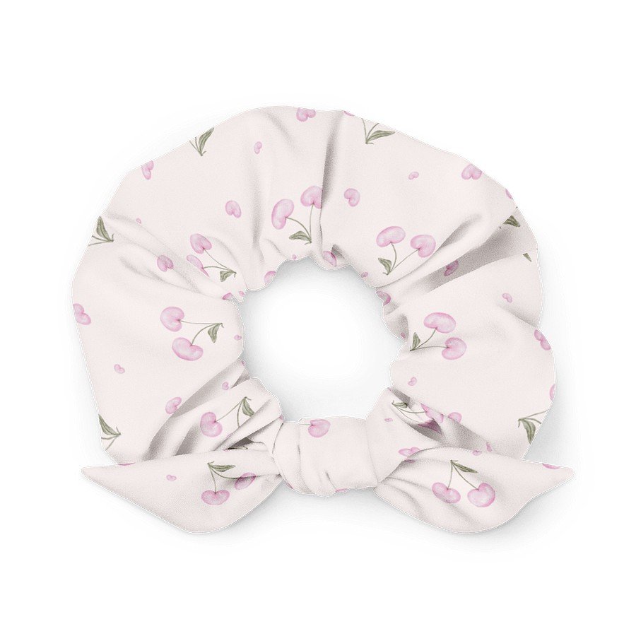 2. Eco-friendly light pink scrunchie featuring cherry blossom design, displayed flat on a white surface