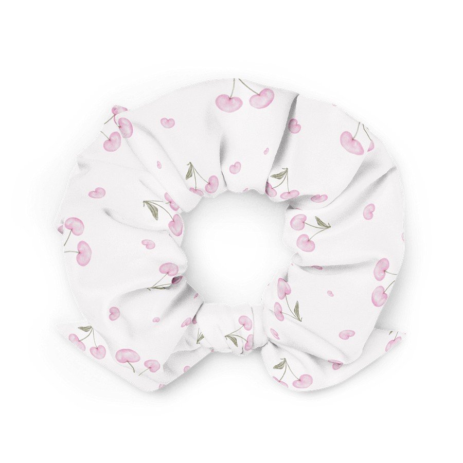 2. White scrunchie featuring pink cherry blossom pattern, crafted from eco-friendly materials, displayed in a flat lay