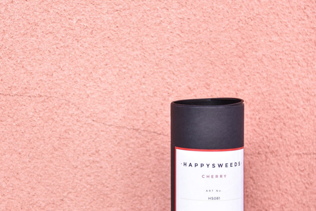 7. HAPPYSWEEDS Cherry Blossom umbrella packaging against pink background