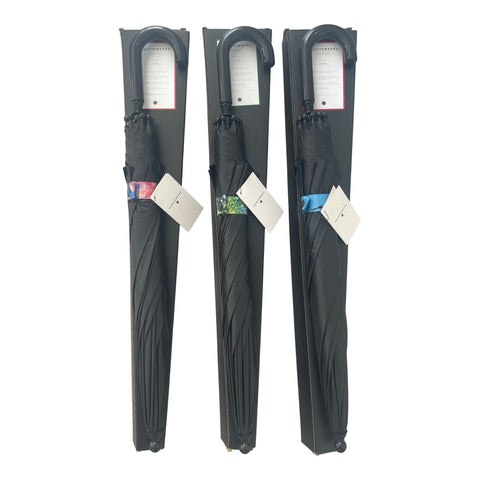 3. Three packaged children's umbrellas with black exterior and visible cherry blossom design tags, featuring curved handles