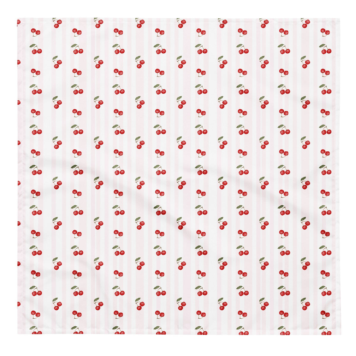 2. Flat lay of cherry-patterned bandana with red cherries and green leaves on white background