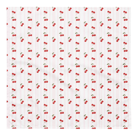 2. Flat lay of cherry-patterned bandana with red cherries and green leaves on white background