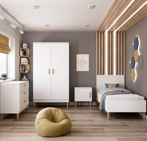 1. White chest of drawers in a Scandinavian-style children's room with matching furniture and decor