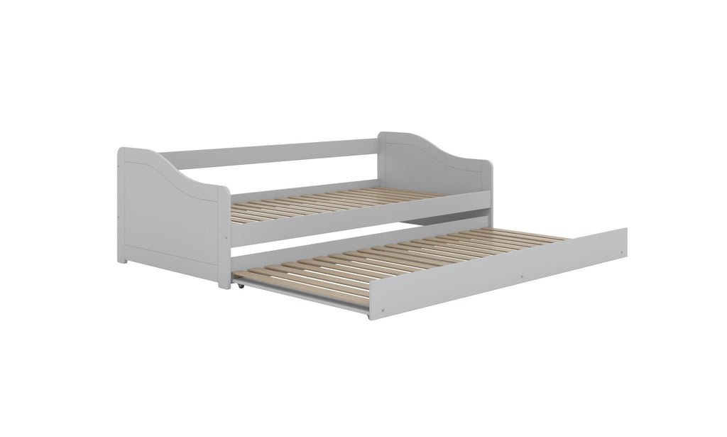 8. Children's white bed with both upper and lower slatted bases visible in studio