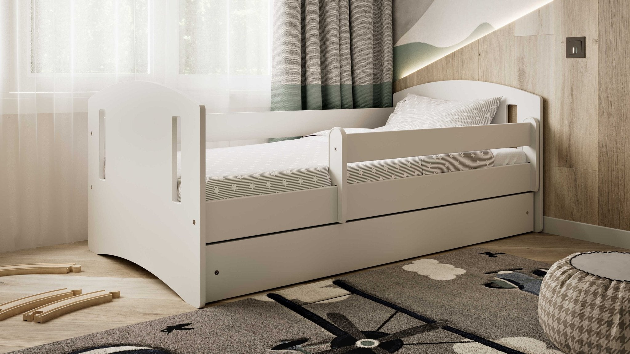 1. White children's bed with star-patterned bedding in a cozy room with natural light