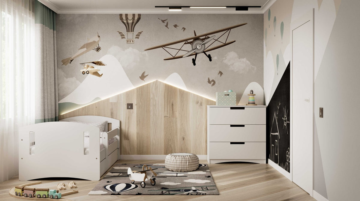 1. White children's bed in a decorated room with airplane-themed wallpaper and toys