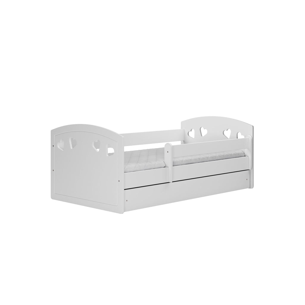 7. Studio shot of white children's bed with heart cutouts and movable guardrail