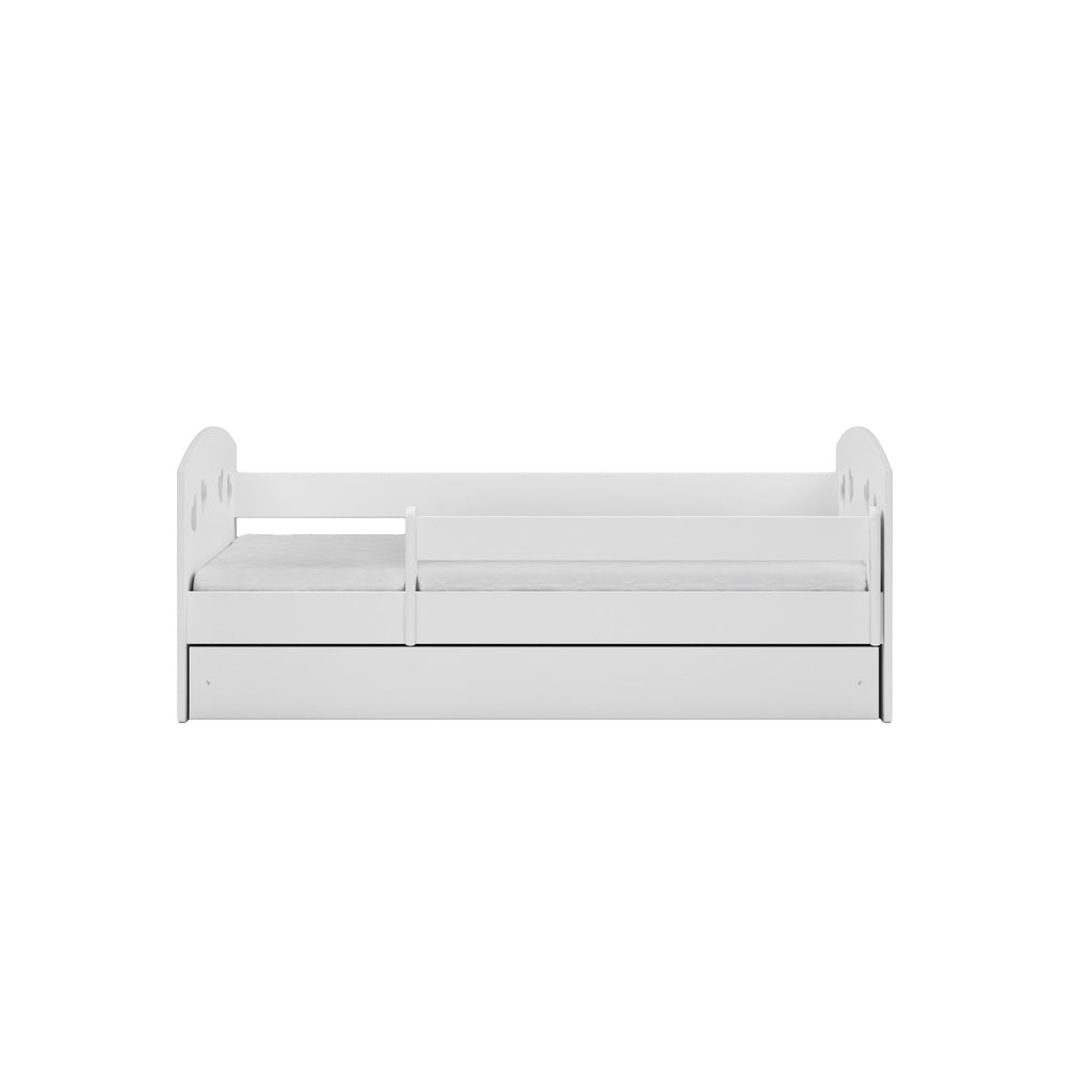 8. Front view of white children's bed with heart cutouts and movable guardrail in studio setting