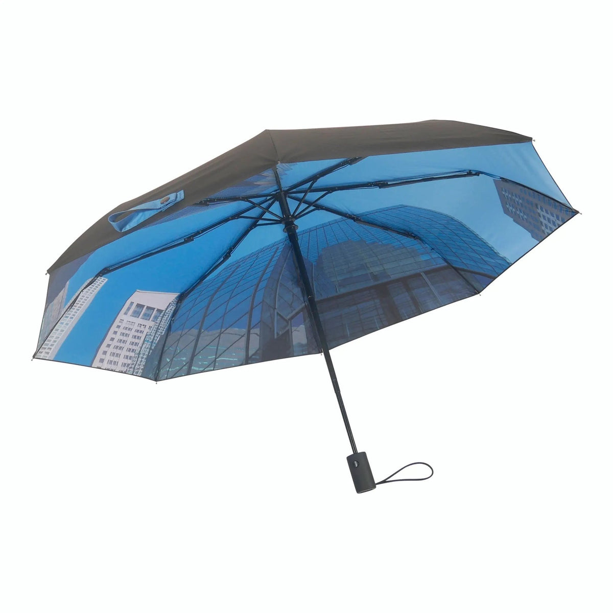 1. City umbrella with blue cityscape pattern and black exterior, open with visible handle, showcasing urban design