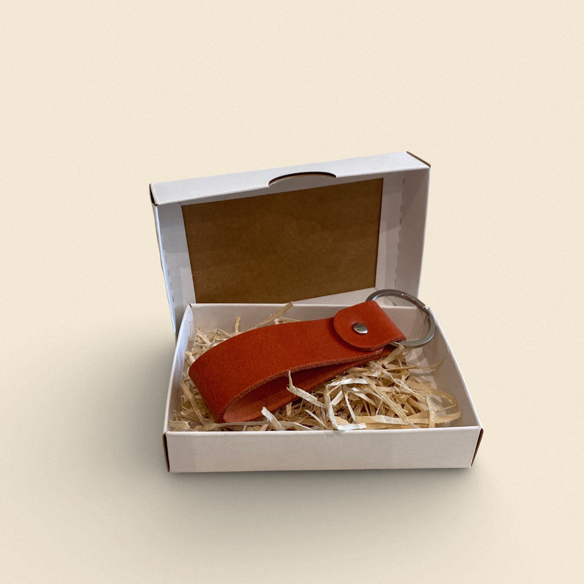 4. Orange handmade leather keychain by Yoru in white gift box with straw filling