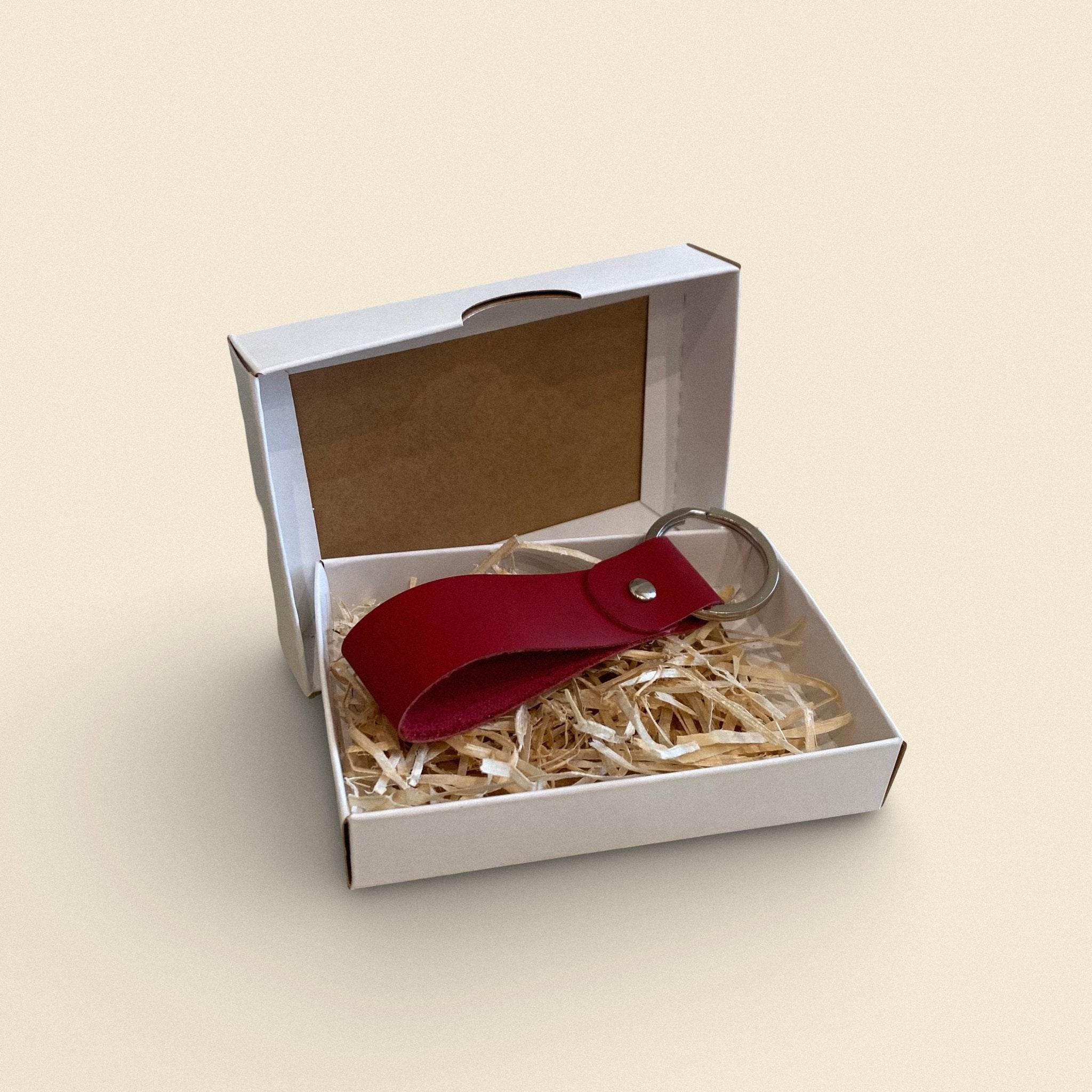 3. Red handmade leather keychain by Yoru in white gift box with straw filling