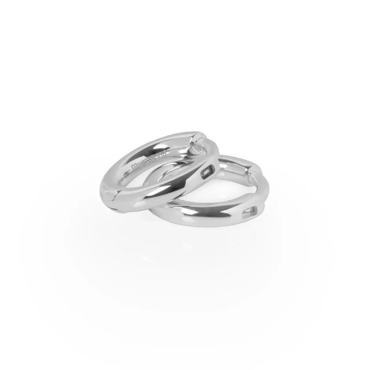 3. Close-up of MyaMoon silver small hoop earrings, showing clip fixing and polished finish