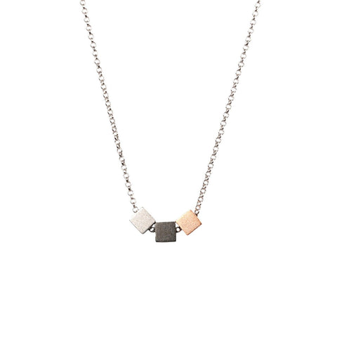 1. MyaMoon Satin Cube Choker in rhodium and rose gold plating, featuring 925 silver chain with cube accents, shown in studio