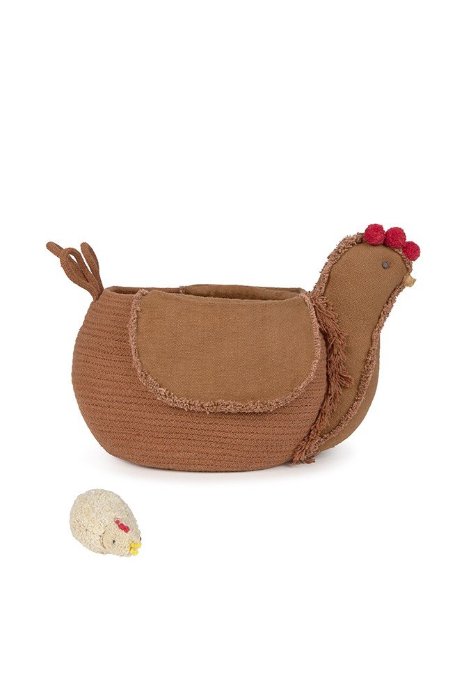 4. Studio shot of Lorena Canals chicken pouf in beige cotton with fringes, showcasing its unique design and texture