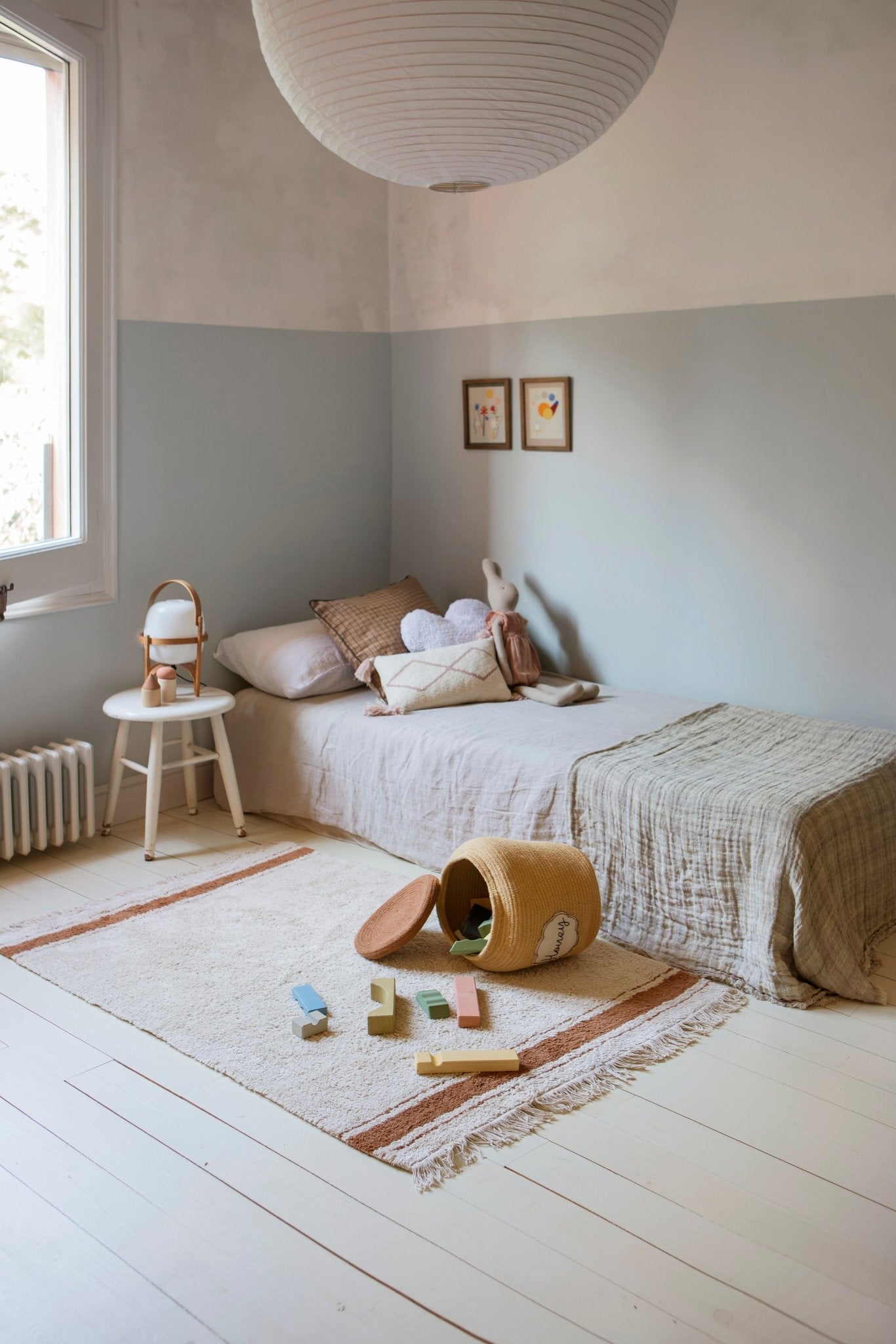 3. Children's room with honey yellow basket labeled 'Honey' on floor, surrounded by toys and neutral decor
