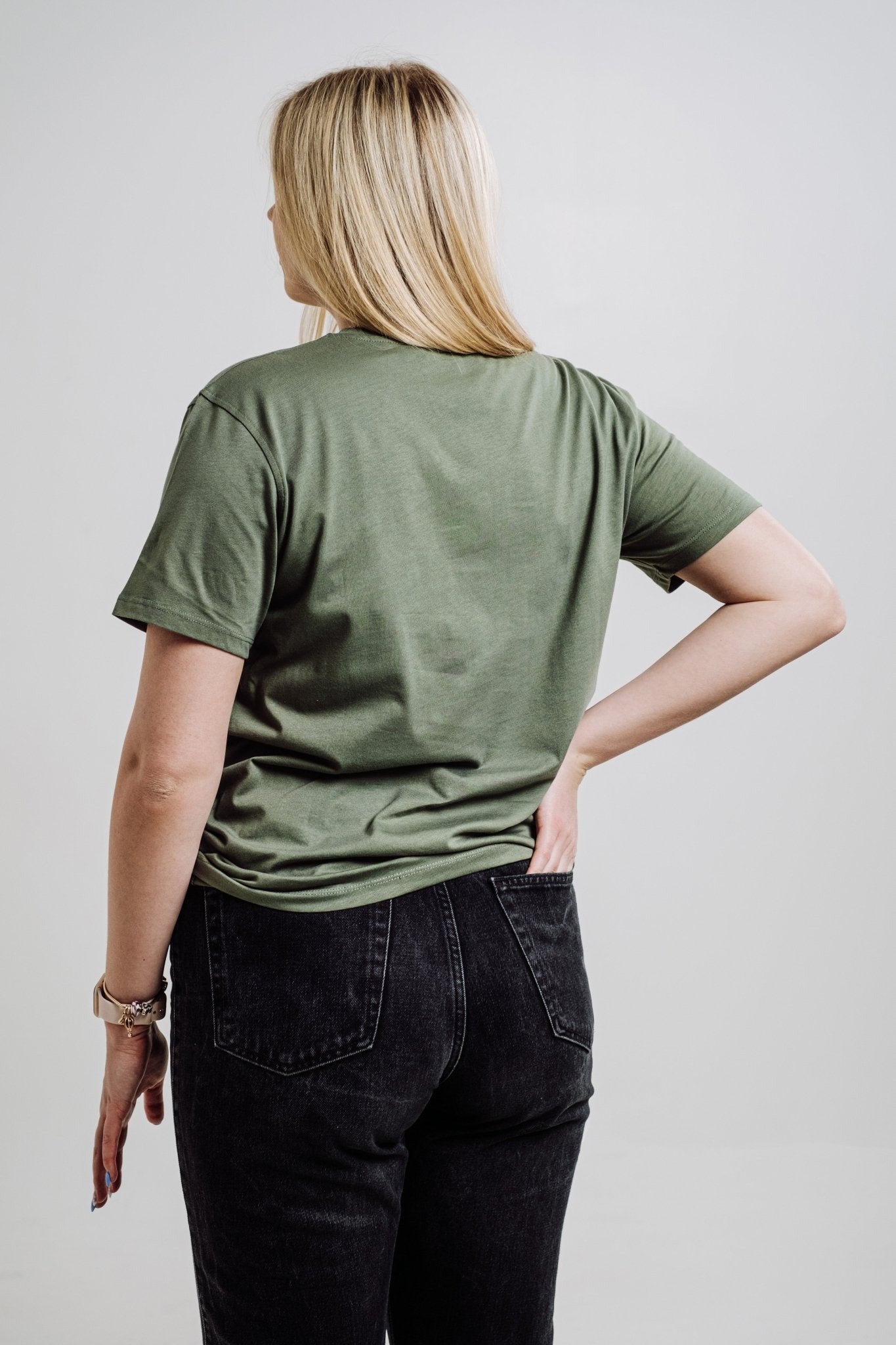6. Back view of unisex khaki Deer T-shirt by Sossu worn by female model, showing relaxed fit