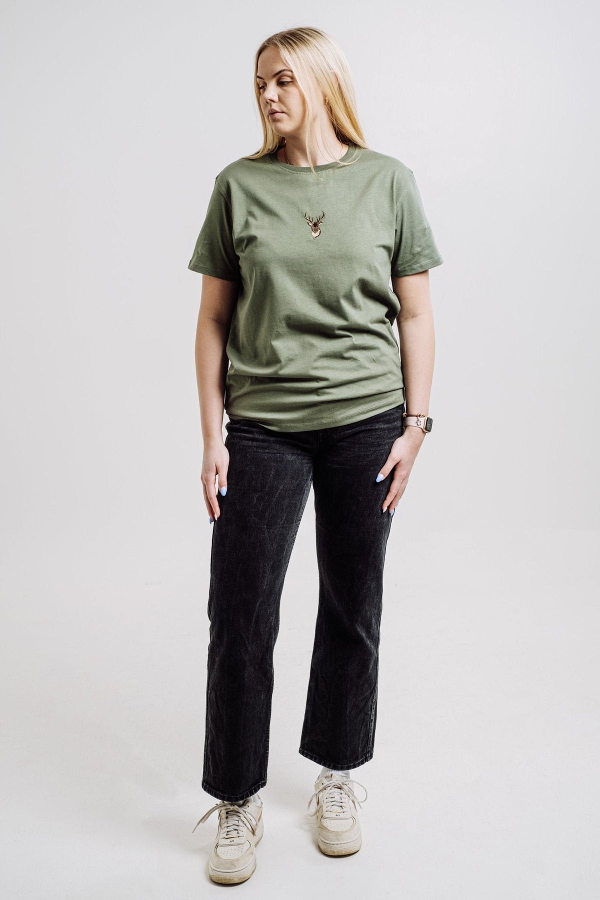 4. Unisex khaki Deer T-shirt by Sossu worn by female model, full body view in studio setting
