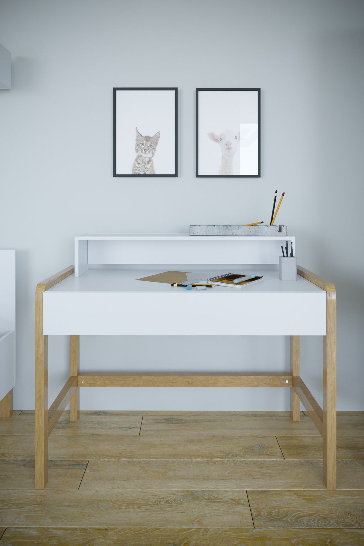 1. Scandinavian-style children's desk with white tabletop and oak legs in a room setting with wall art and stationery