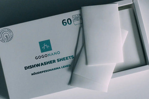 4. Close-up of GoGoNano dishwasher sheets partially removed from box, eco-friendly packaging, 60 loads