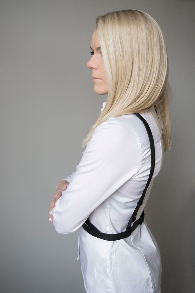 3. Women's black leather body harness by RR shown from side, worn over white shirt