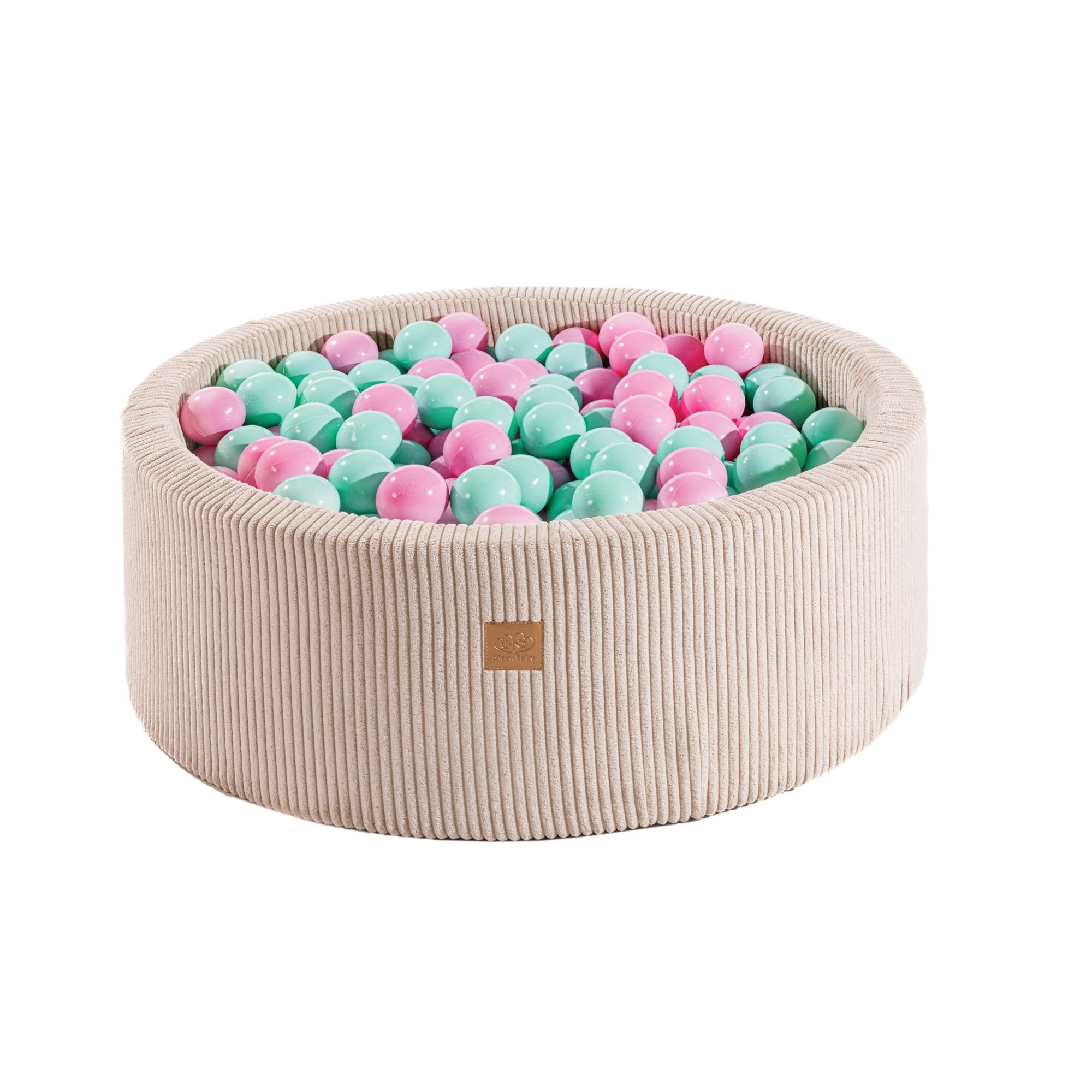 1. Round velvet ecru ball pit filled with pink and mint balls, designed for children, featuring soft hypoallergenic foam and zippered cover, ideal for sensory play and motor skill development.