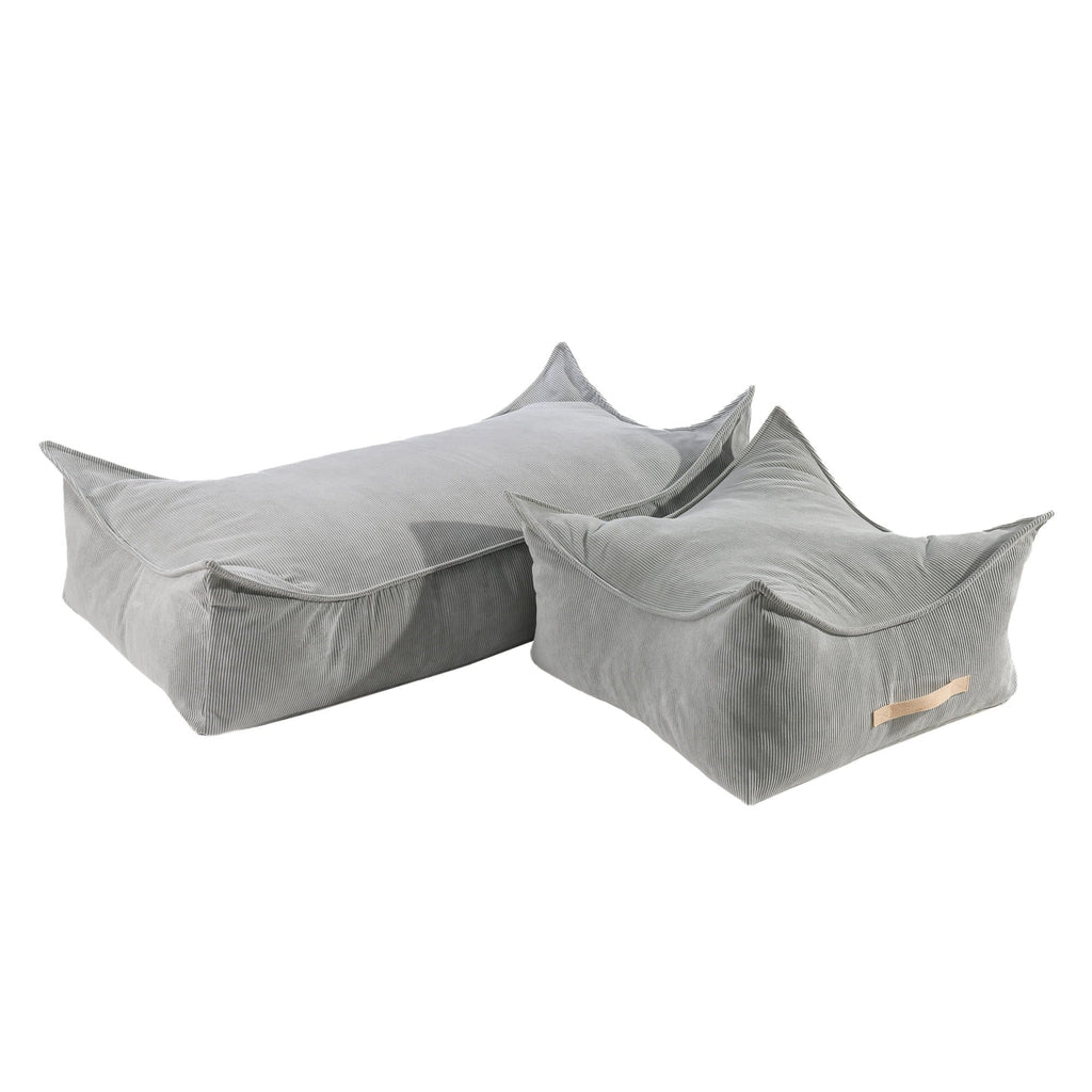 3. Two grey corduroy poufs by MeowBaby, one square and one rectangular, shown in a studio setting