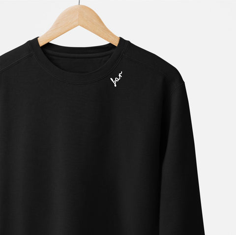 2. Black unisex sweatshirt with white 'far' embroidery on hanger against white background