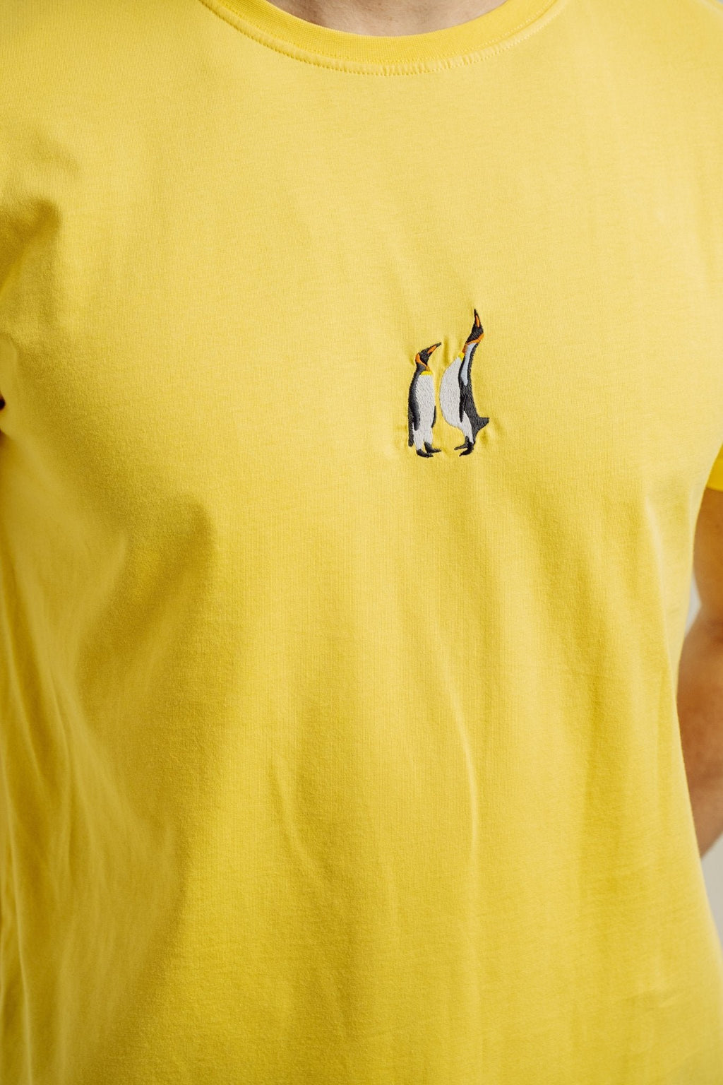 7. Close-up of penguin embroidery on yellow Emperor Penguin T-shirt by Sossu
