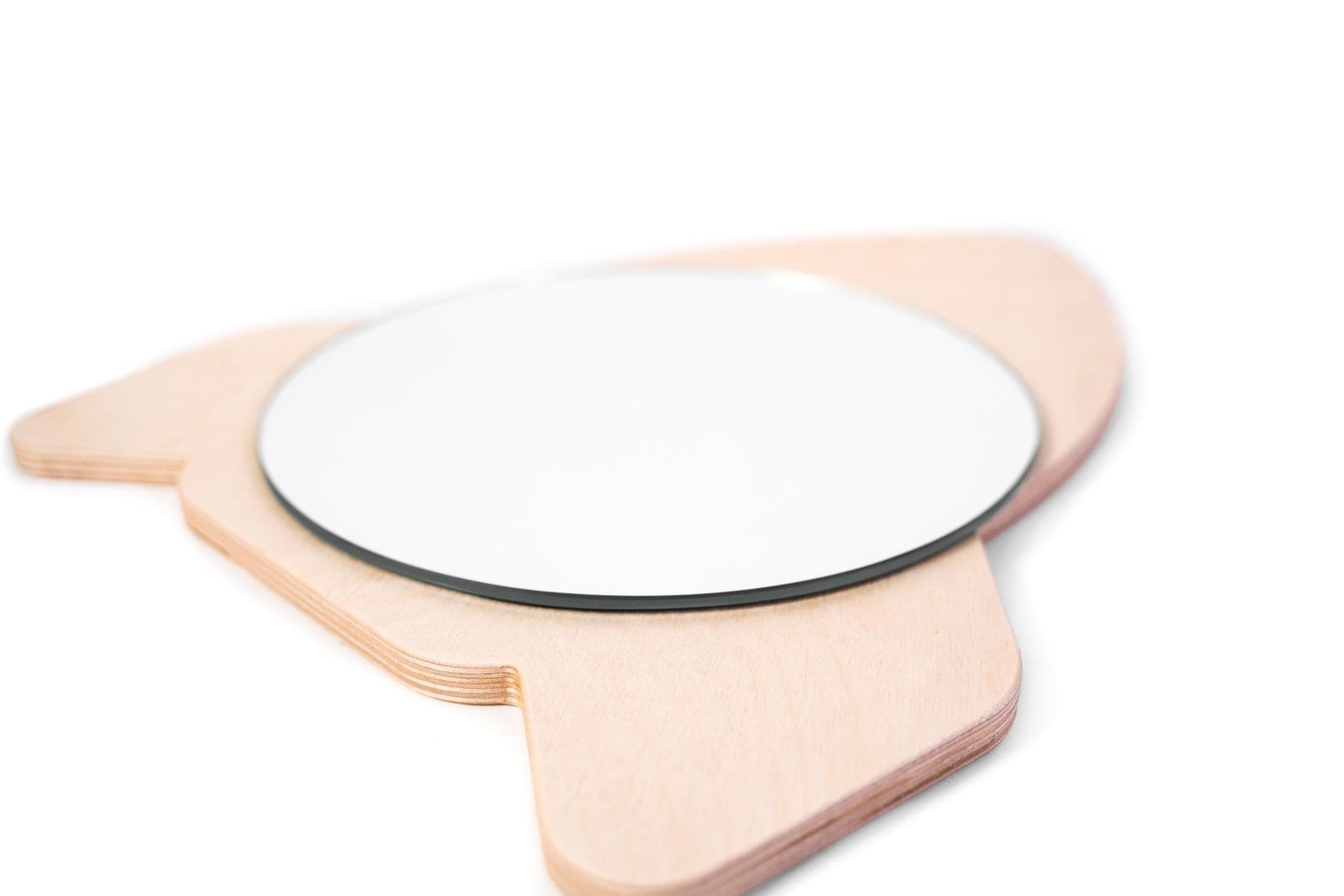 6. Close-up of rocket ship shaped children's wall mirror showing smooth plywood edges