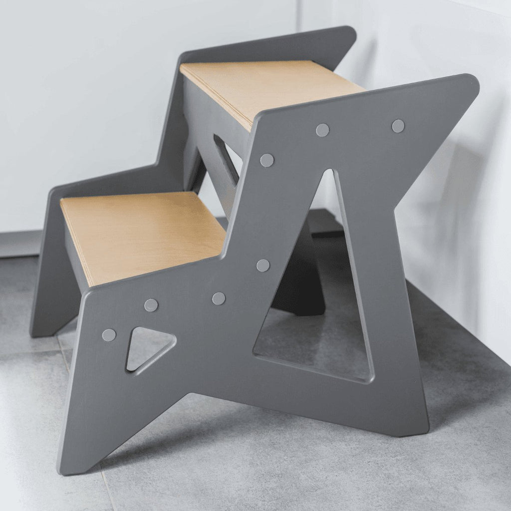 4. Side view of grey and natural wood Ewart Woods step stool on tiled floor