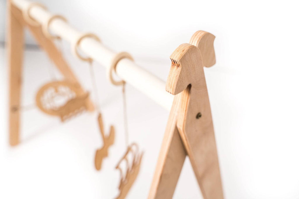 3. Detail of wooden play gym frame with Viking-themed design elements