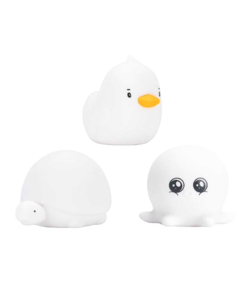 3. Studio shot of Rabbit & Friends silicone lamps in duck, octopus, and turtle shapes on white background