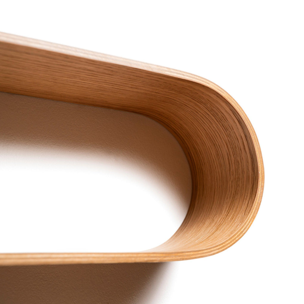 5. Close-up detail of the curved edge of the S-shaped wooden wall shelf made from baltic birch plywood