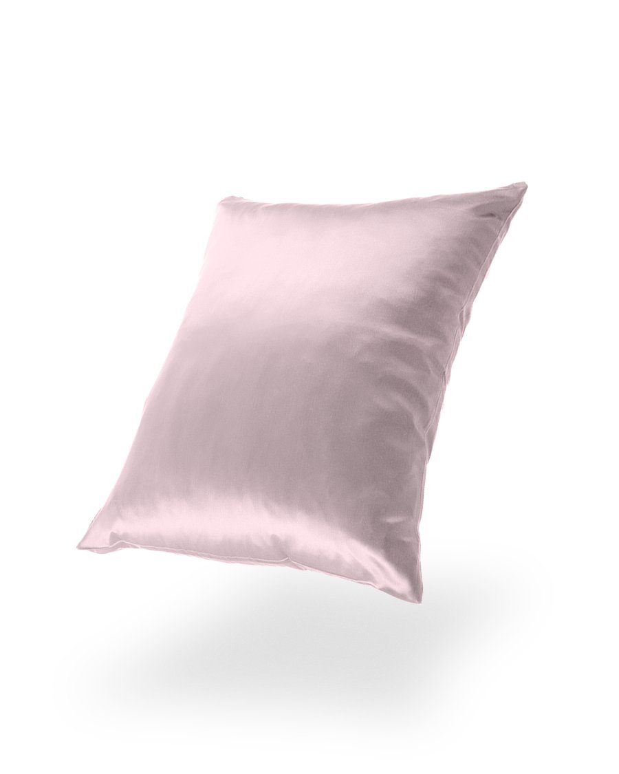 10. Pink Mulberry silk pillowcase floating against a black background, highlighting softness