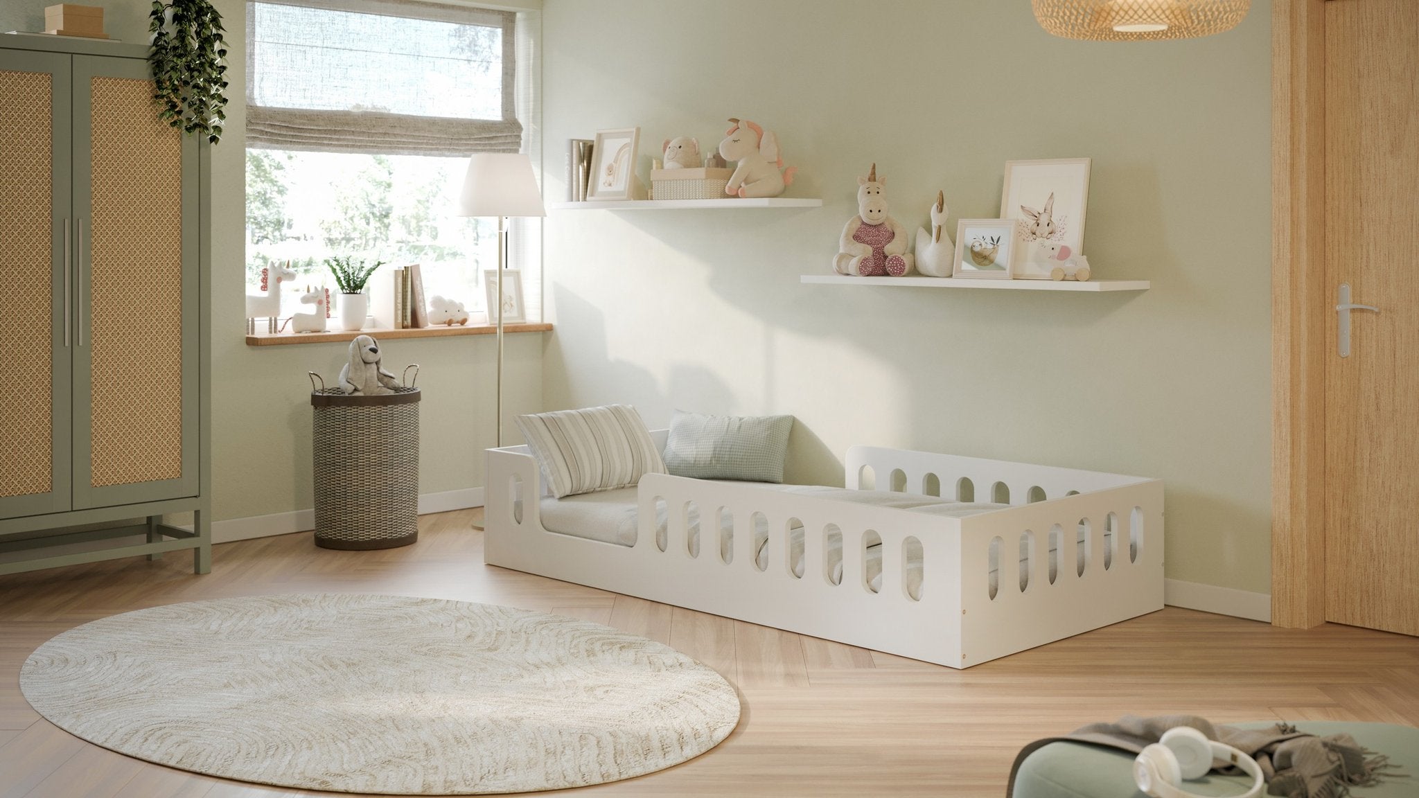 1. Bright children's room featuring white floor bed with decorative pillows and wall art