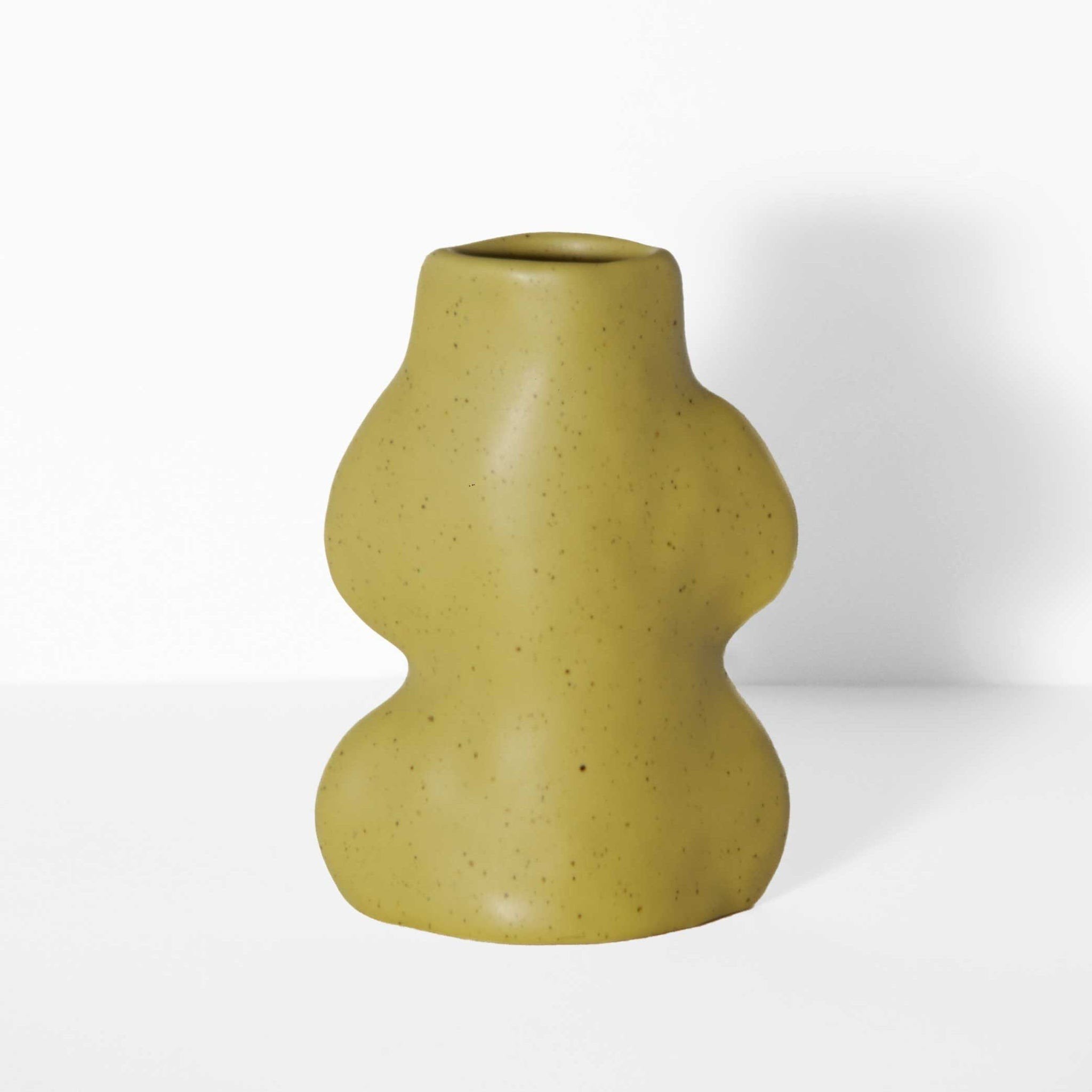 5. Studio shot of Fluxo Ceramic Vase in pistachio, showcasing its unique flowing lines