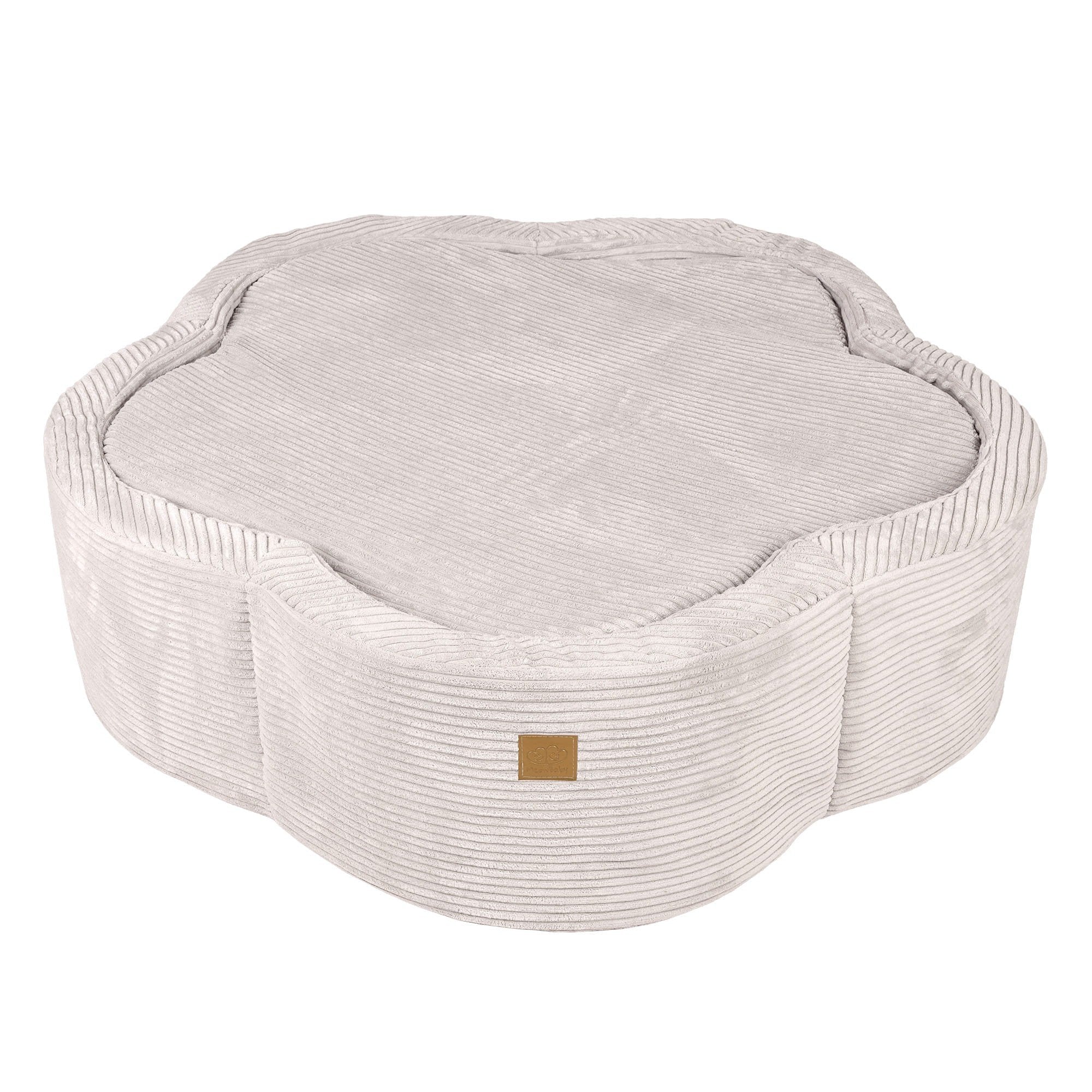 2. Ecru flower-shaped foam baby ball pit with ribbed texture and brown brand patch, shown with cover on in studio setting