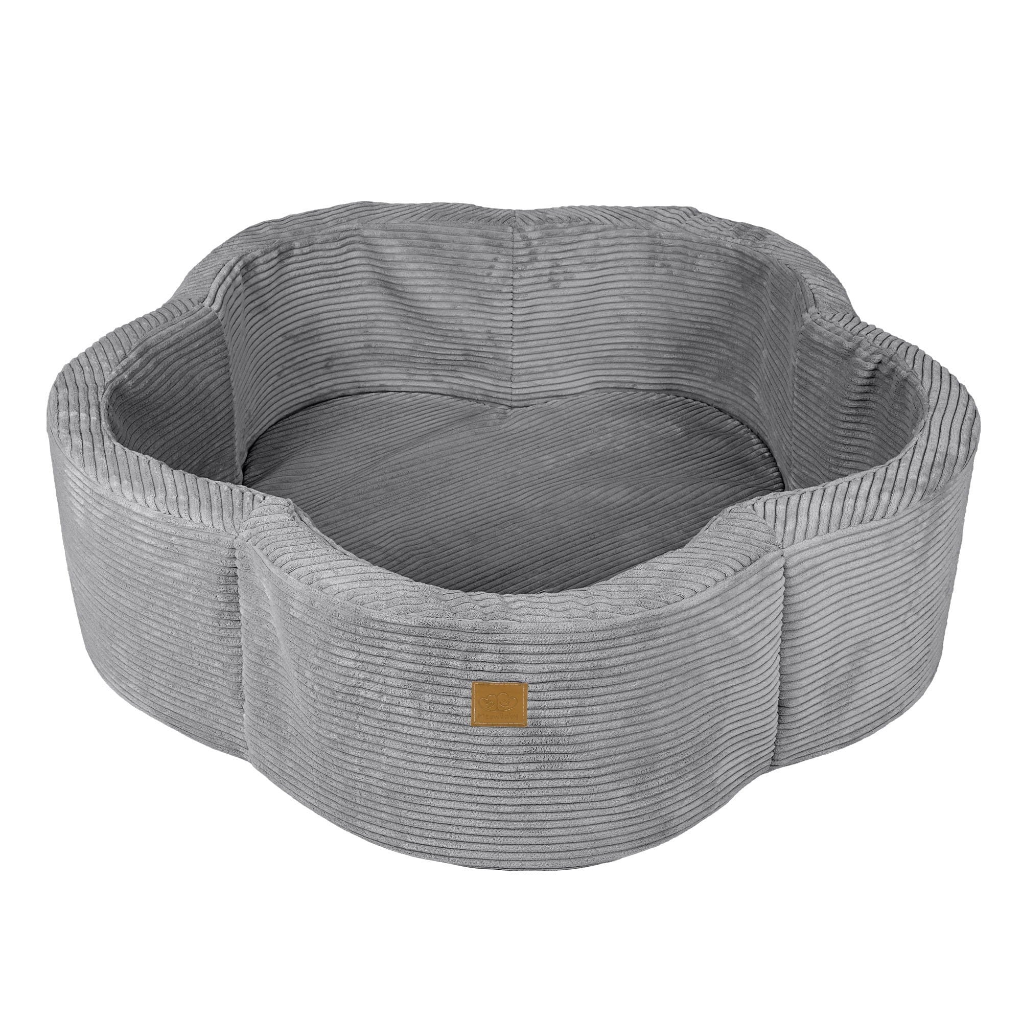 2. Grey flower-shaped foam baby ball pit with ribbed texture, shown empty with a small brown logo patch on the side