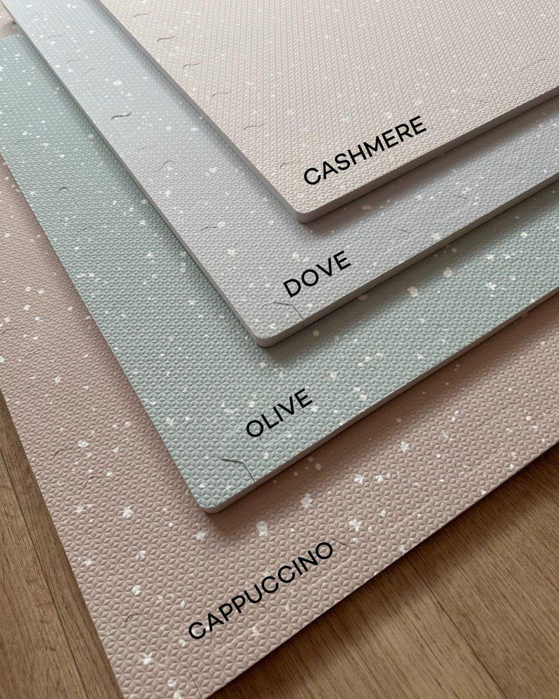 6. Flat lay of foam puzzle playmats in cappuccino, olive, dove, and cashmere colors