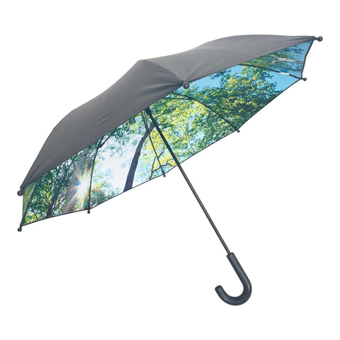 1. Children's umbrella with forest design featuring pine and birch trees, black exterior, and curved handle, shown open with sunlight filtering through leaves
