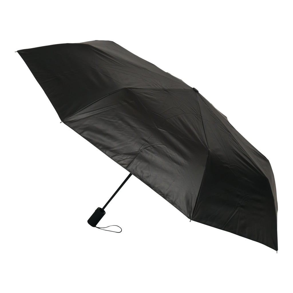 2. Black exterior of forest print umbrella shown open with black handle