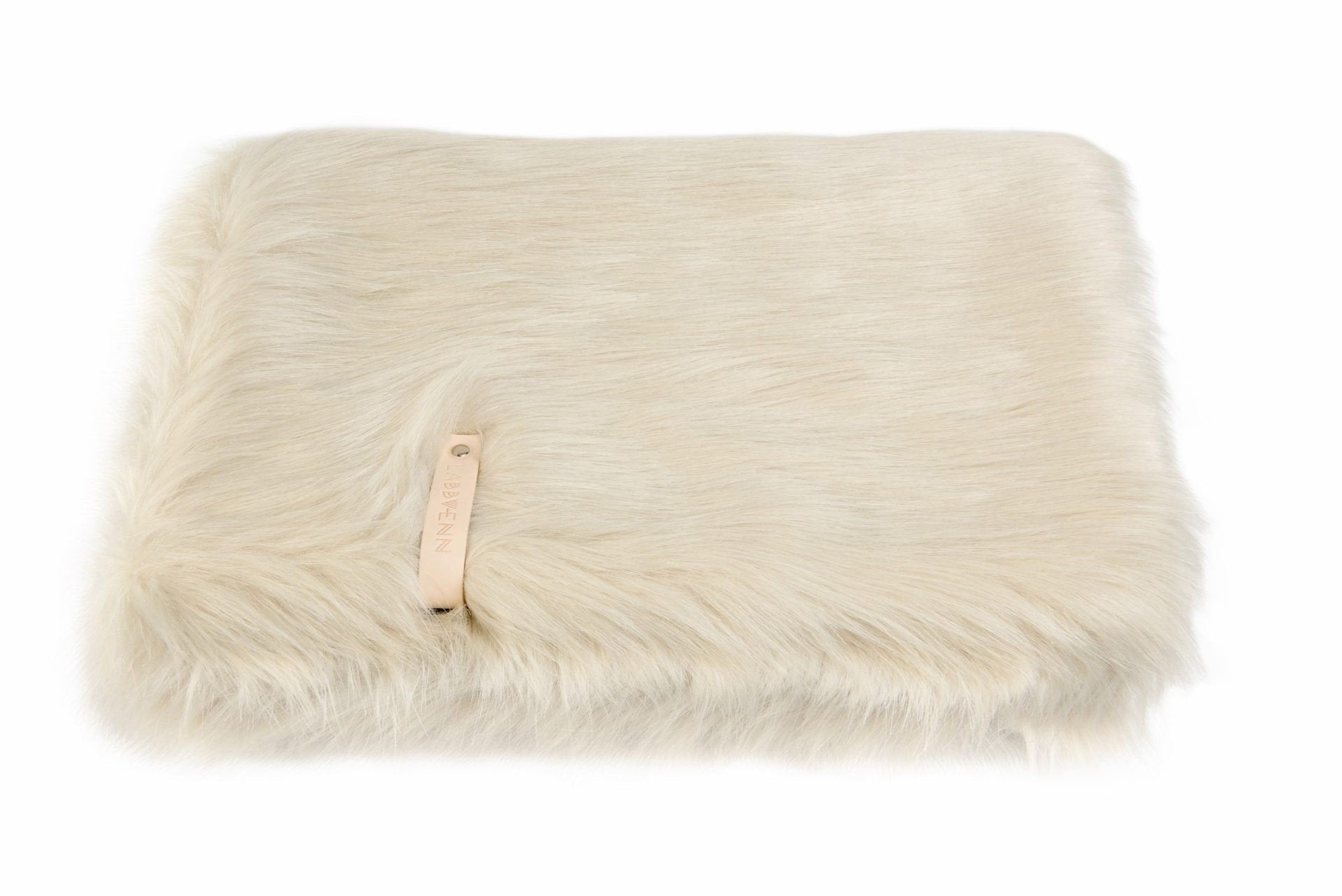 2. Labbvenn Föra white faux fur blanket folded on a white background, highlighting fluffy texture and leather brand tag