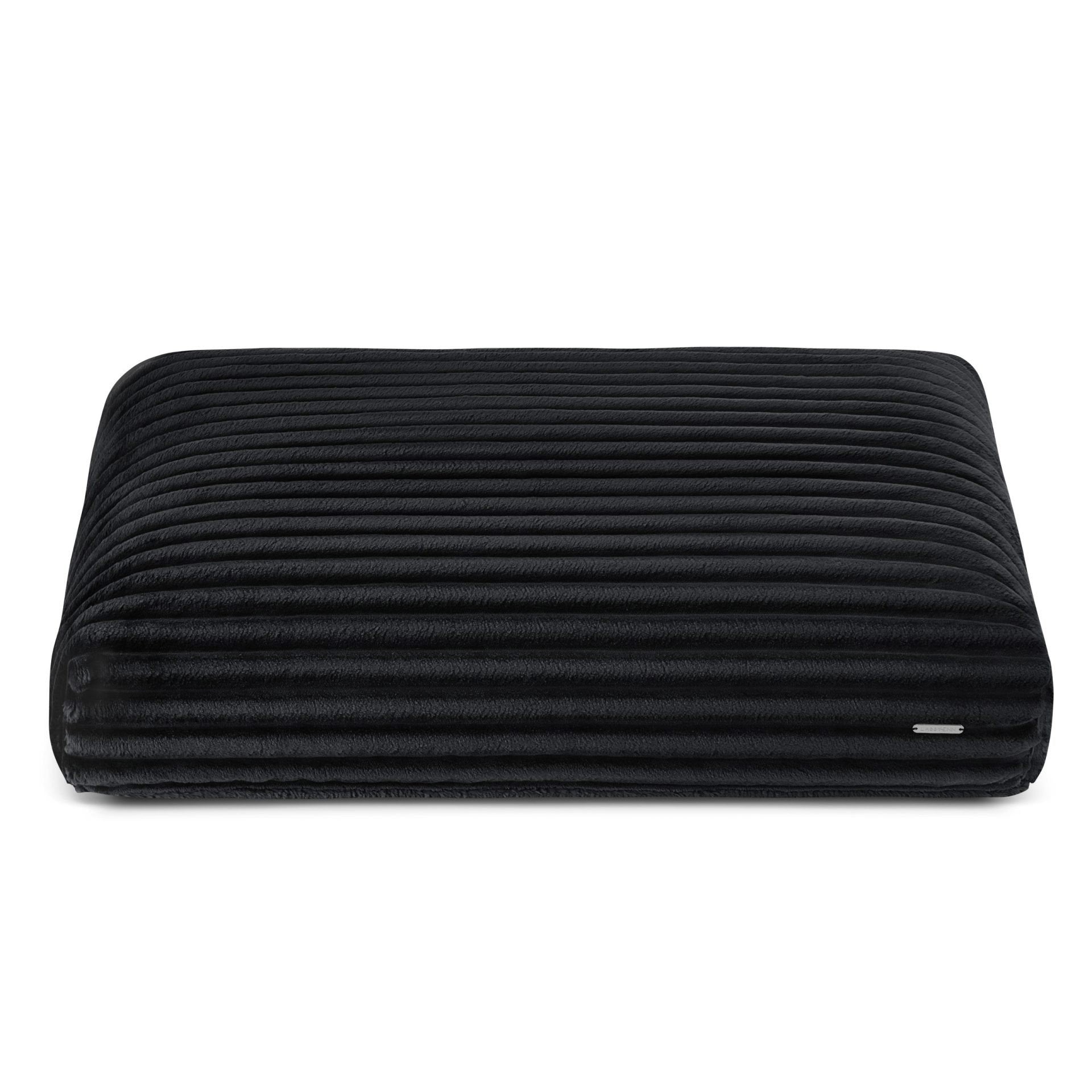 2. Black ribbed dog cushion by Labbvenn in studio setting, showcasing plush texture and sleek design