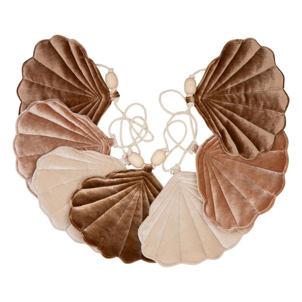 2. Studio shot of velvet shell garland in brown, beige, and cream colors with wooden beads on a white background