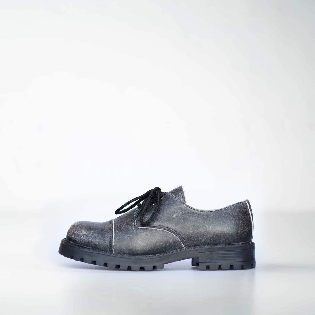 4. Left side view of Samelin's Antique Widgets sneaker, featuring genuine leather and enhanced grip outsole