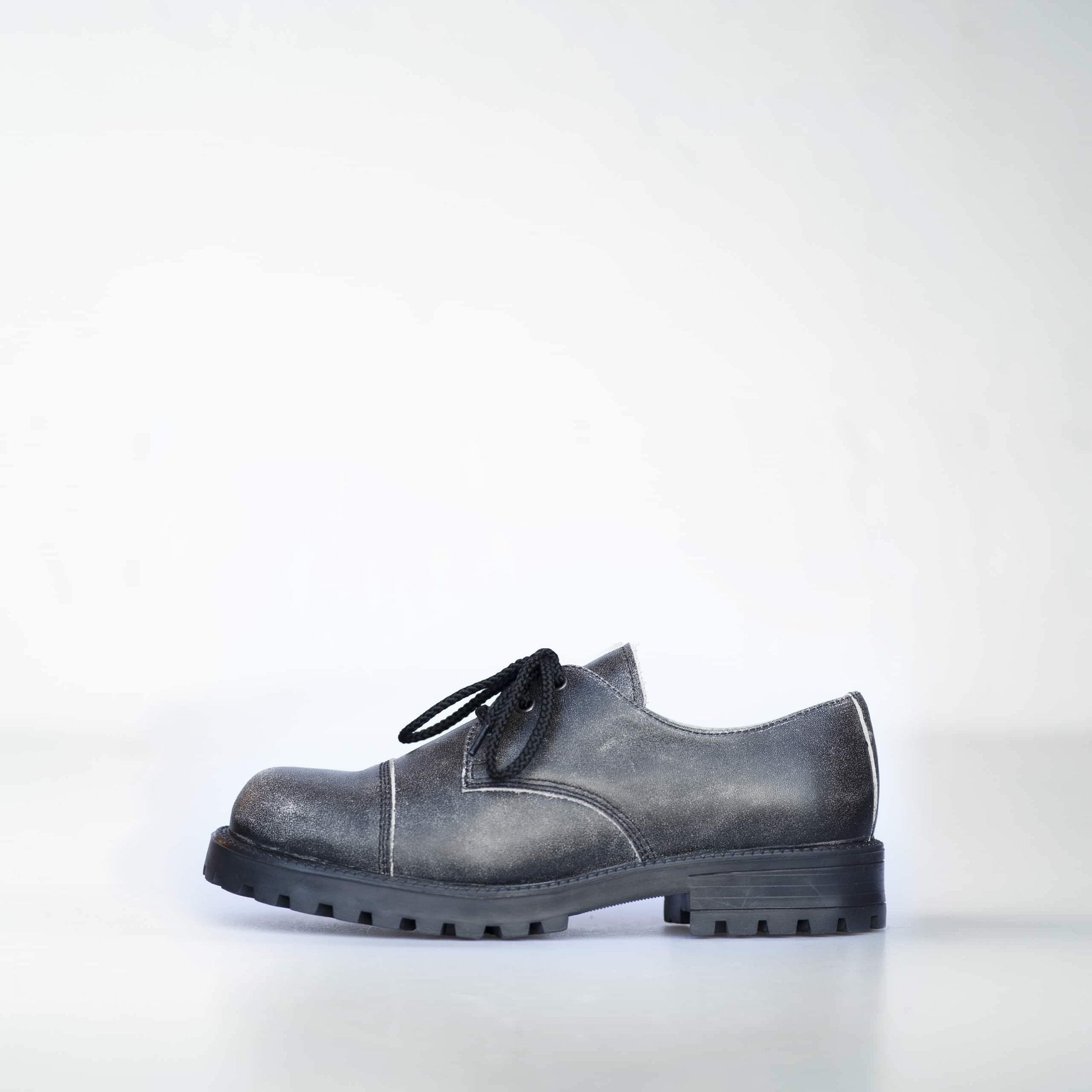 4. Left side view of Samelin's Antique Widgets sneaker, featuring genuine leather and enhanced grip outsole